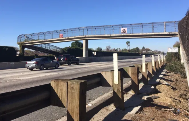Downey Freeway Fighters Hang NO MORE LANES Banner over 5 Freeway
